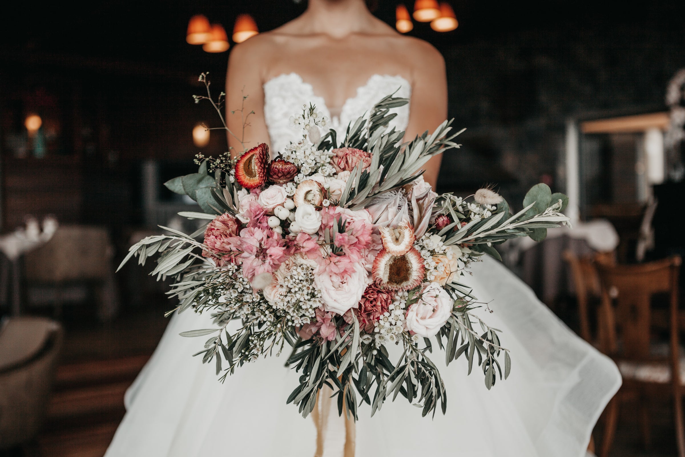 bride with bright bouquet of wedding flowers
